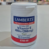 Lamberts Vitamin E 400 iu supplement container on a white surface