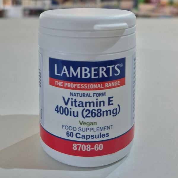 Lamberts Vitamin E 400 iu supplement container on a white surface