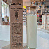 Glass candle with a cardboard box displaying text and a barcode on a white surface.