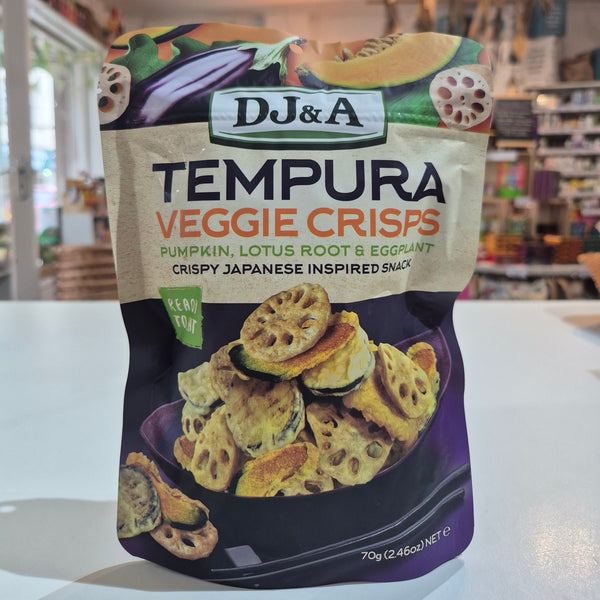 Packaging of DJ&A Tempura Veggie Crisps with a store interior in the background