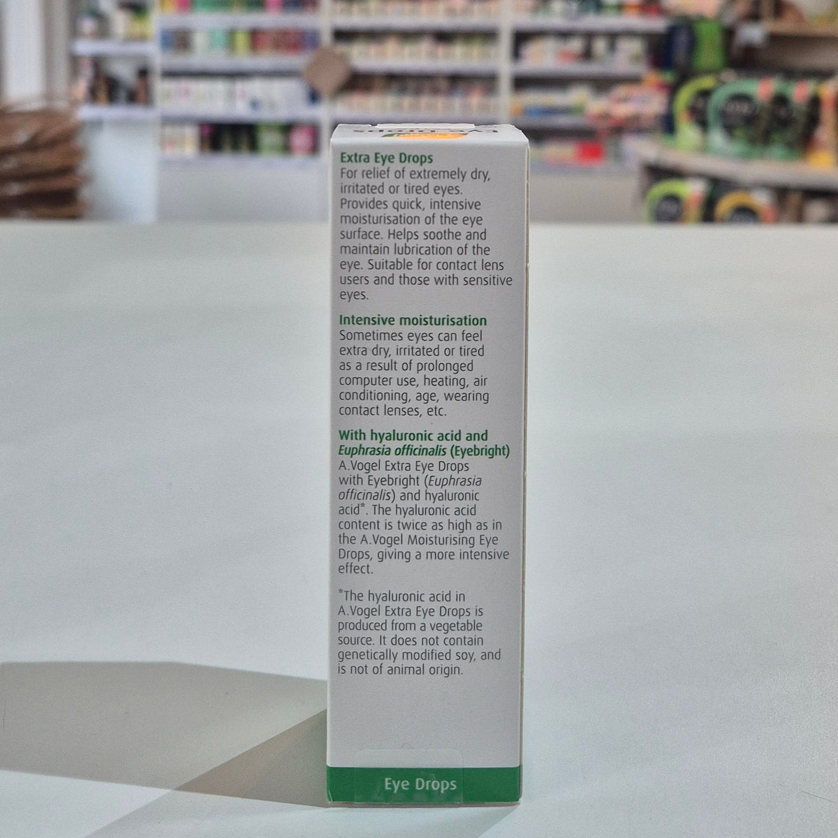 Box of eye drops with product details on a counter in a store setting