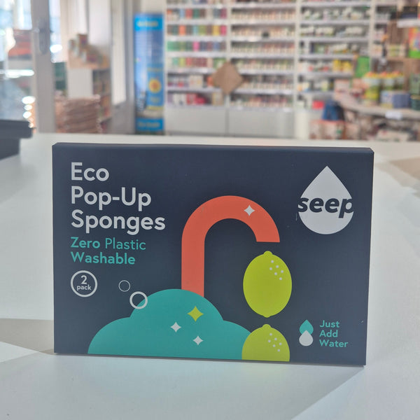 Box of seep eco pop-up sponges on a shelf with a blurred store background