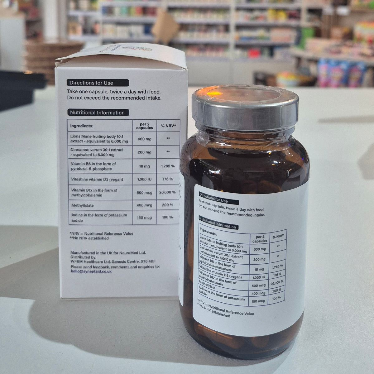 A bottle of Synaptaid Advanced Brain Support supplement with its packaging box, displaying the product name and brief description. 