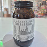 Jar of Viridian High B5 Complex supplement on a white surface with a blurred background. Brown supplement bottle with label on a white surface