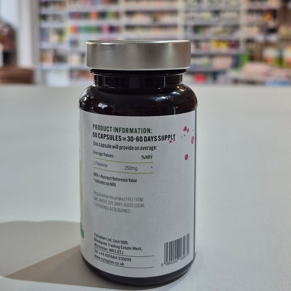 Bottle of supplements on a white surface with a blurred store background