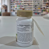 Close-up of a bottle with a label in a blurred indoor setting