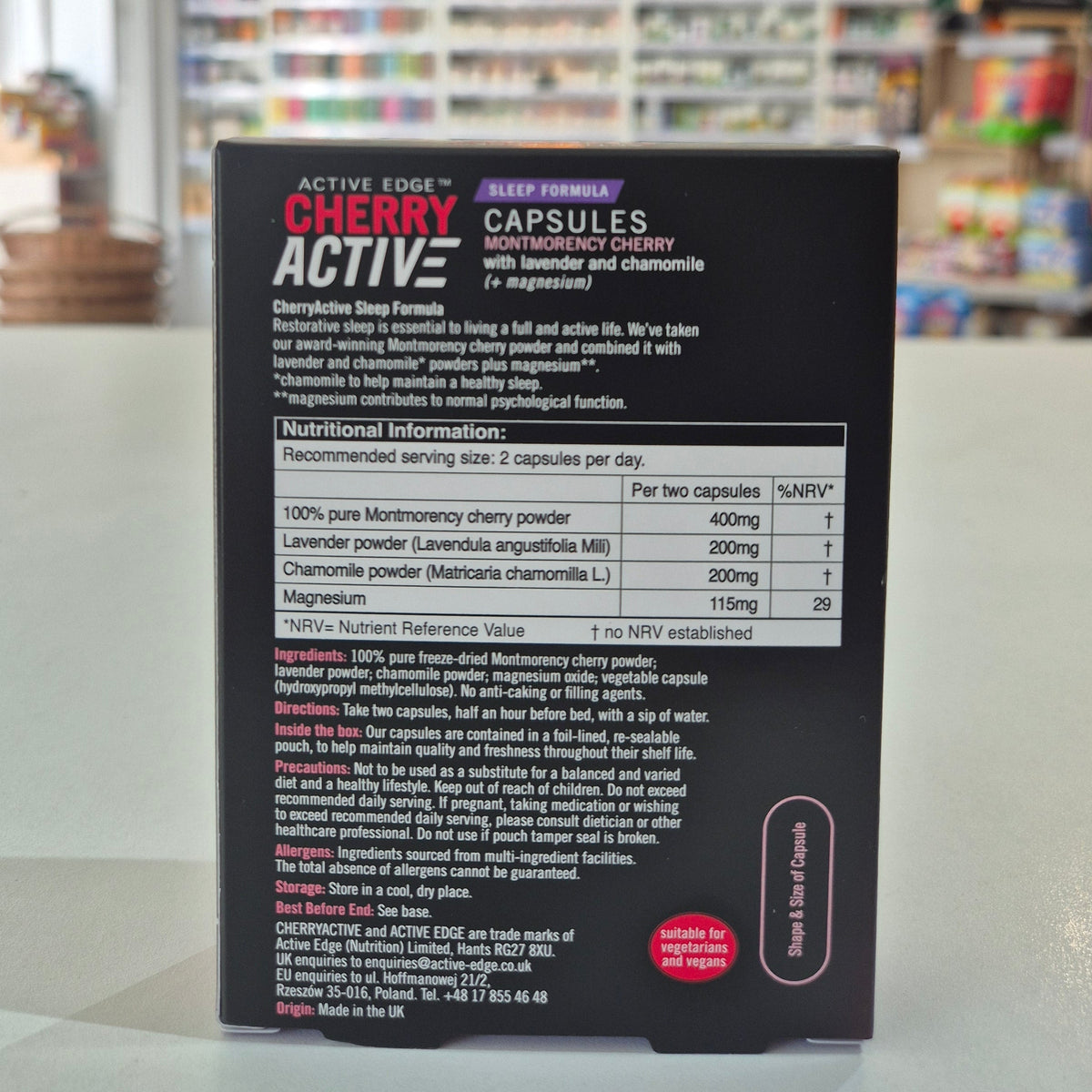 Box of Cherry Active capsules with a blurred indoor background