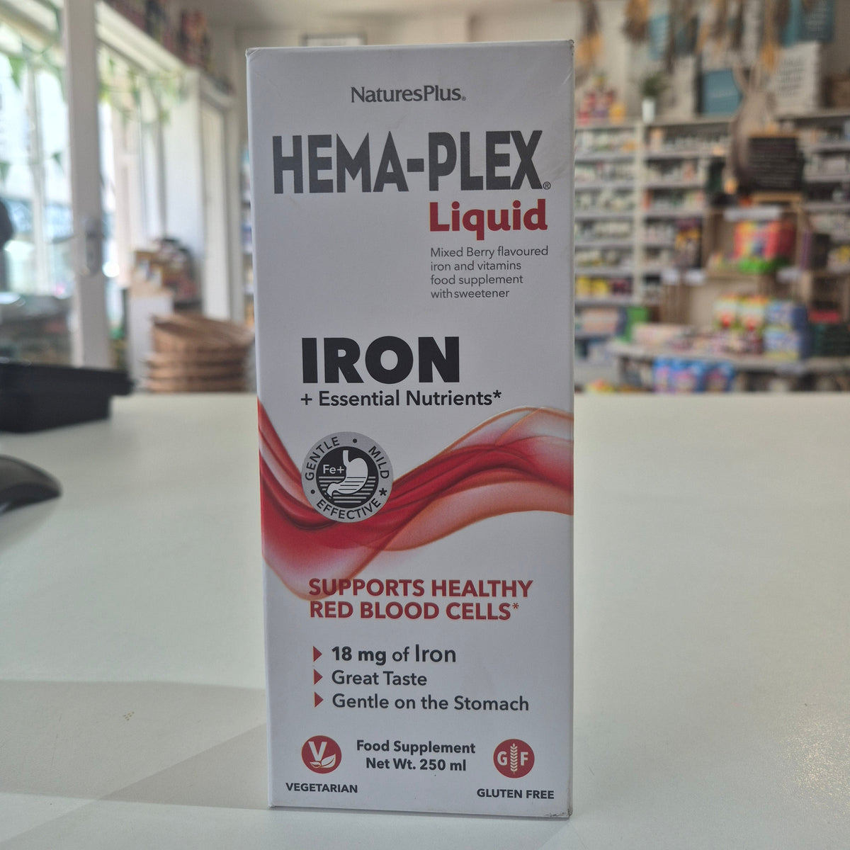 Box of NaturesPlus Hema-Plex Liquid Iron supplement on a counter.