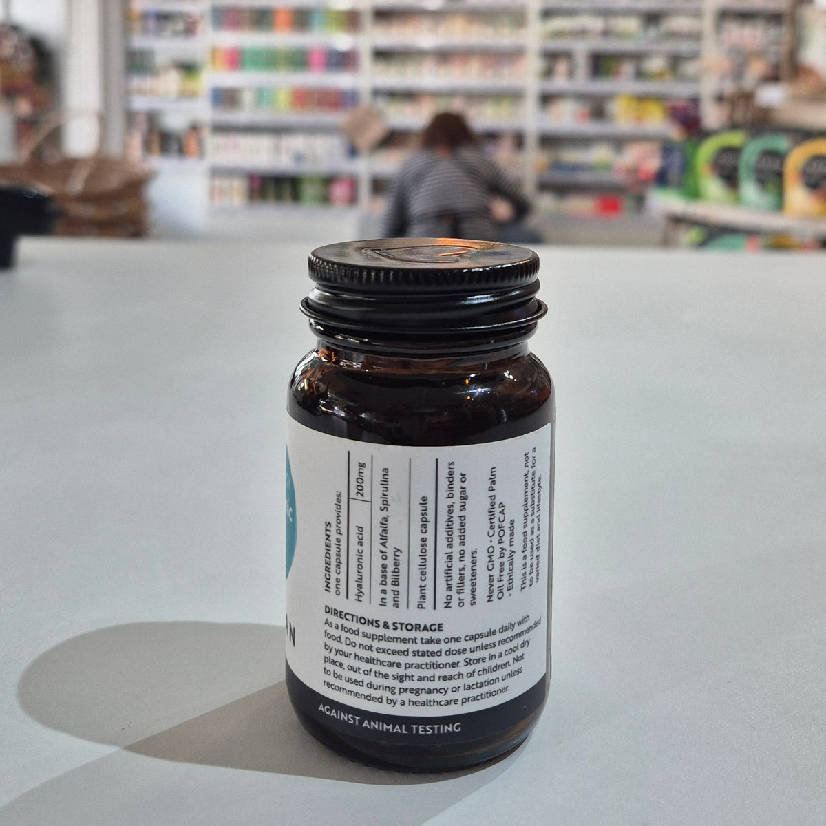 Bottle with a label on a counter in a store setting