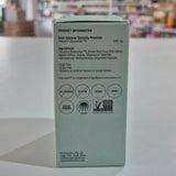 Back of a green supplement capsule packaging with product information and labels.
