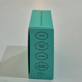 Fussy deodorant refill packaging on a counter with a store shelf in the background, Vegan, Cruelty Free, Natural