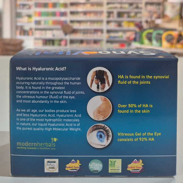 Product packaging with text and images on a blurred store background