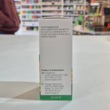 Box of a food supplement with text on a table in a store setting