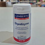 Lamberts Digestizyme supplement container on a white surface with a blurred background