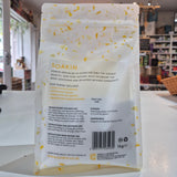 A pack of Soakin Epsom salt, with the branding visible on the front. The packaging is clear, allowing the reader to see the product inside.