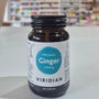 Bottle of Viridian Organic Ginger 400mg capsules on a table with a blurred background