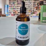 Bottle of Viridian Ionic Magnesium Liquid on a counter with a store background