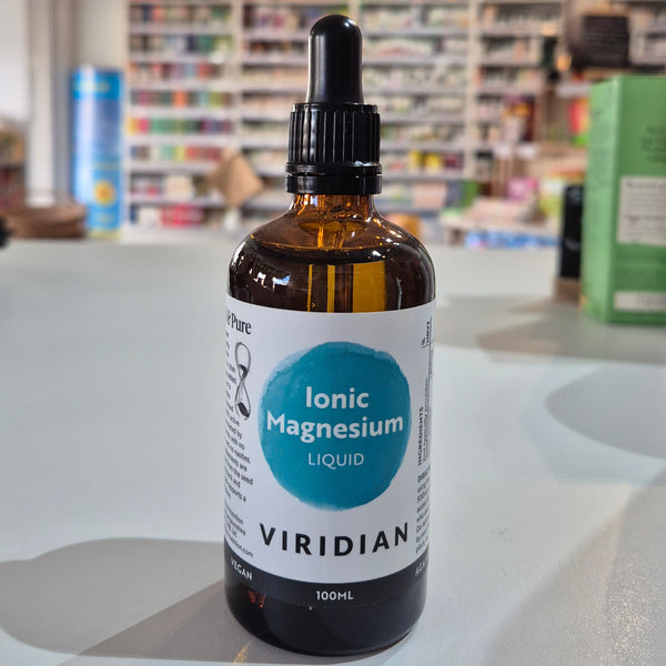 Bottle of Viridian Ionic Magnesium Liquid on a counter with a store background