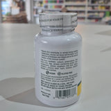 Nature's Plus Shot-O-B12 5000 Mcg lozenge in a white bottle with green and purple label, indicating wild berry flavor and dietary supplement category. Supplement bottle with label on a blurred store shelf background