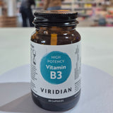 Vitamin B3 supplement bottle with 'Viridian' label on a blurred store background
