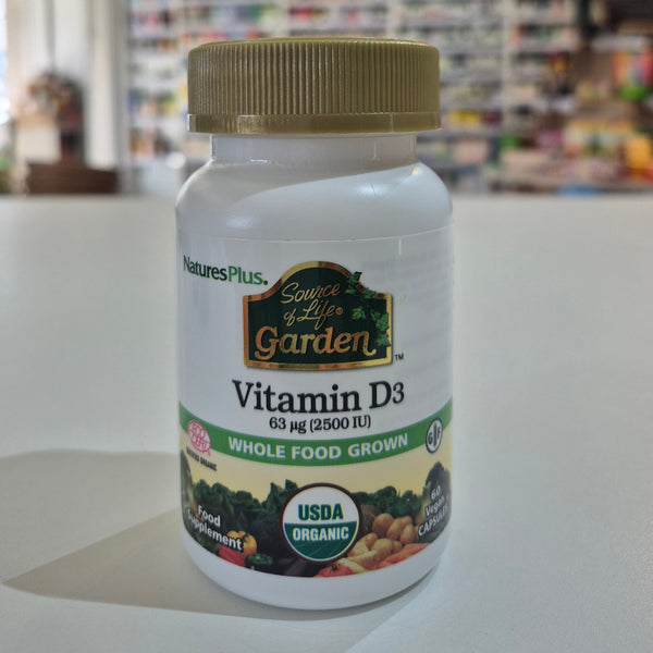 Nature's Plus Vitamin D3 supplement bottle on a white surface with a blurred background