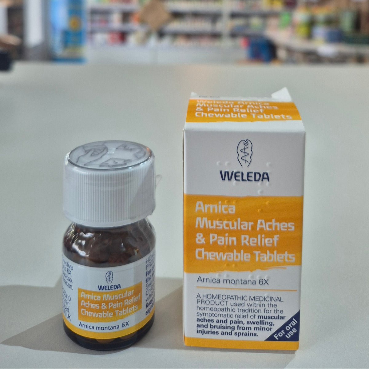 Arnica muscular aches and pain relief chewable tablet box and bottle