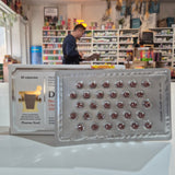 Supplement packaging with visible branding in a store setting