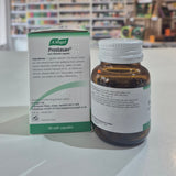 A bottle and its packaging of A Vogel Prostasan on a table with a blurred store background.