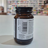 Brown glass bottle with a label on a white surface