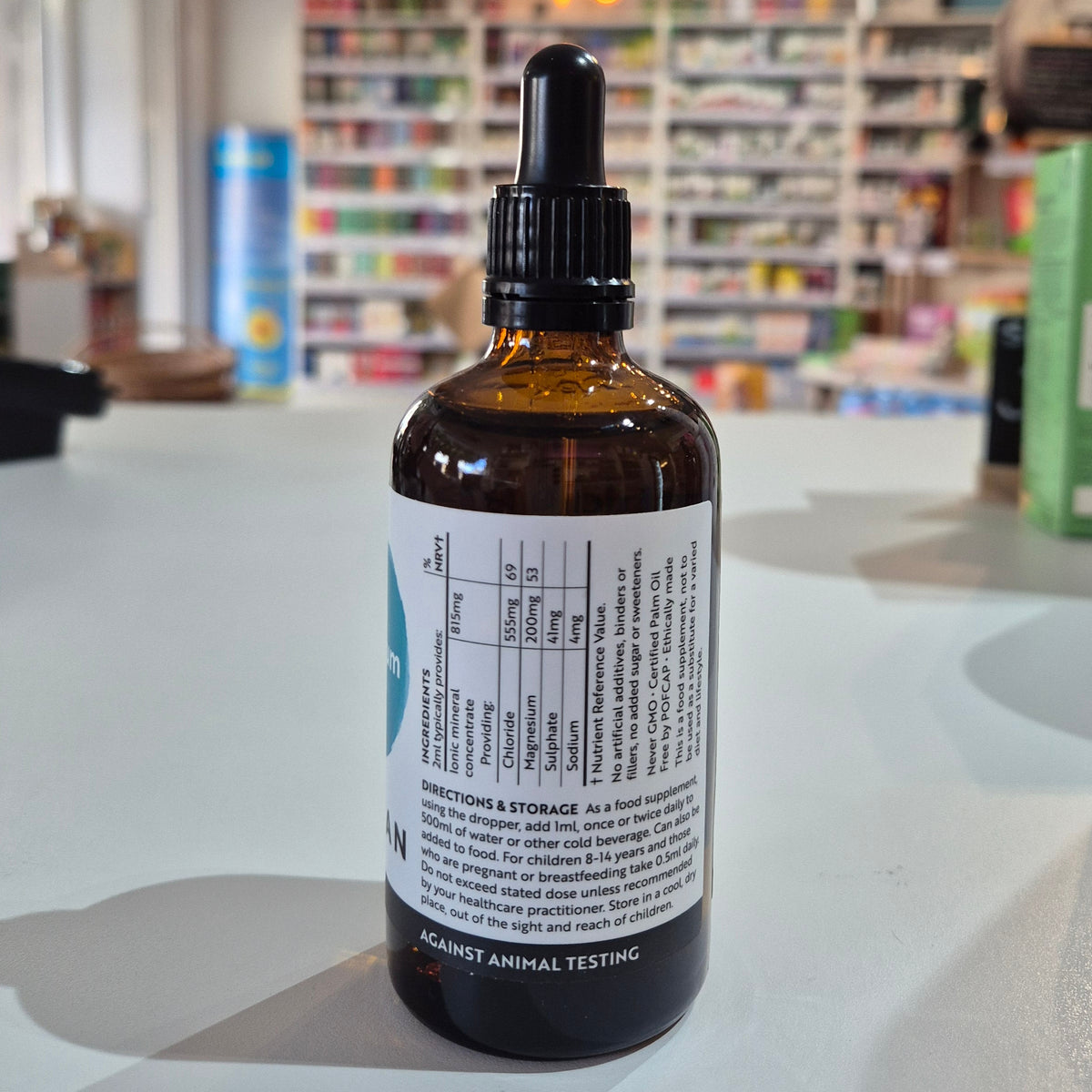 Bottle with dropper on a table in a store setting