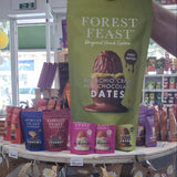 Forest Feast pistachio crisp milk chocolate dates packaging on a store shelf.