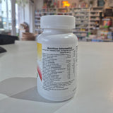 Supplement bottle with nutrition information label on a counter in a store setting