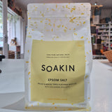 Bag of Soakin Epsom Salt on a counter in a store setting