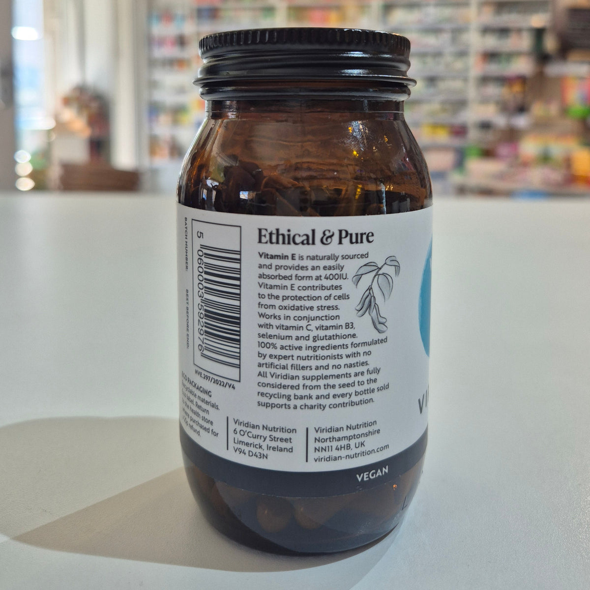 Brown glass jar with 'Ethical & Pure' label on a blurred background