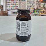 Brown glass jar with 'Ethical & Pure' label on a white surface with a store shelf in the background.