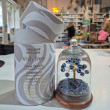 Decorative item with a tree design on a shelf in a store setting