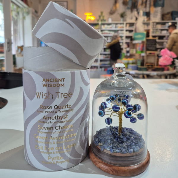 Decorative item with a tree design on a shelf in a store setting