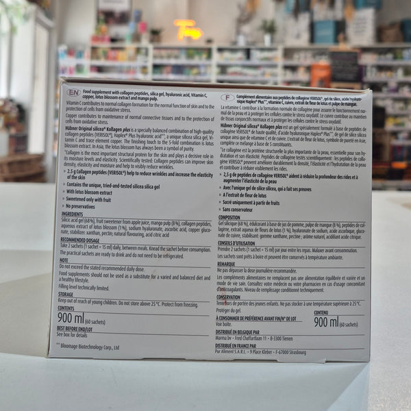 Back of a product box with text and branding, blurred indoor background