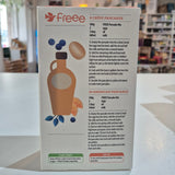 Product packaging with branding and text on a blurred indoor background