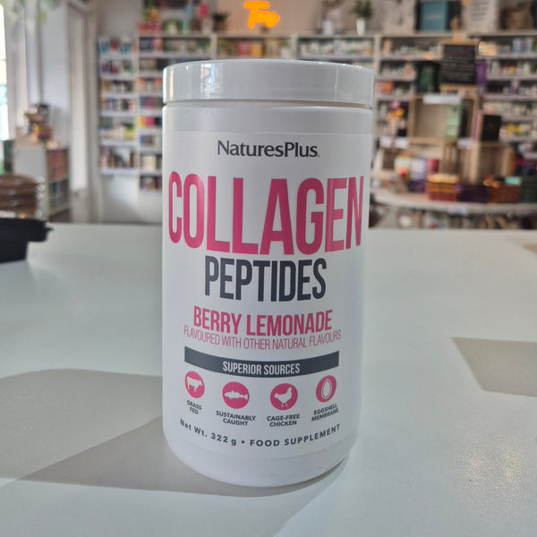 NaturesPlus Collagen Peptides container on a table with a blurred store background