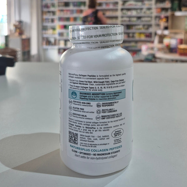 Collagen peptides supplement bottle on a table with a store interior in the background. White supplement bottle with text and QR code on a blurred store background