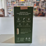 Green packaging box with text and icons on a blurred background