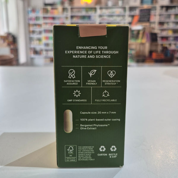Green packaging box with text and icons on a blurred background