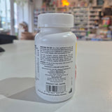 Supplement bottle with label on a table in a store setting