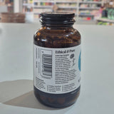 Bottle of Viridian Lutein Eye Complex on a counter with a blurred store background. Brown glass bottle with a label on a white surface, blurred background