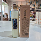 Candle with packaging on a white surface