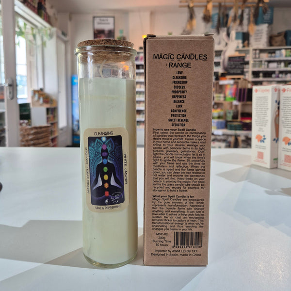 Candle with packaging on a white surface