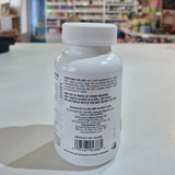 White bottle with label against a blurred indoor background