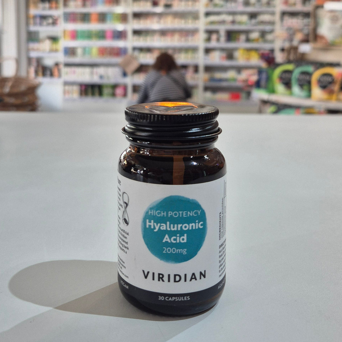 Bottle of Viridian Hyaluronic Acid on a counter in a store setting