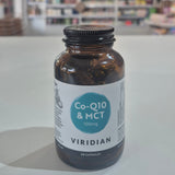 Bottle of Viridian Co-Q10 & MCT supplement on a shelf with a blurred store background